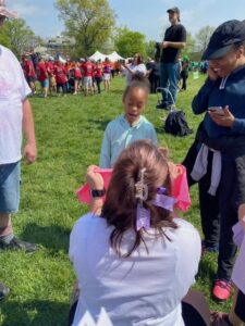 A young girl is presented with a shirt. 