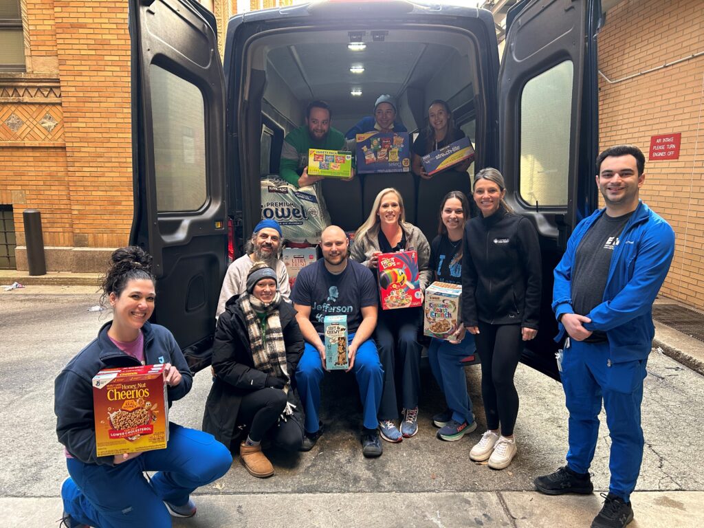 Jefferson Health employees are shown during a Gift of Life Howie's House Stuff the Shuttle event.